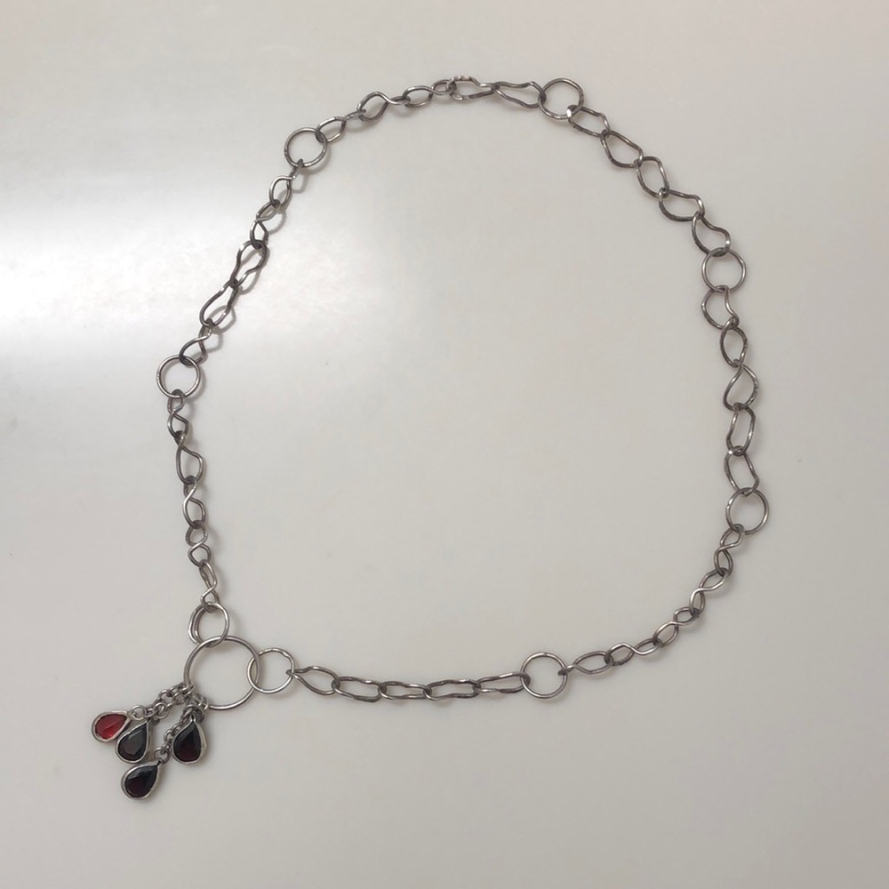 Silver necklace with garnets.